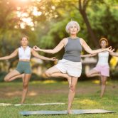Single Leg Stance Test for Balance | Movement Is Freedom Physical Therapy Older woman demonstrates single leg balance while standing on one leg, illustrating the Single Leg Stance Test used to assess balance, stability, and fall risk in older adults.
